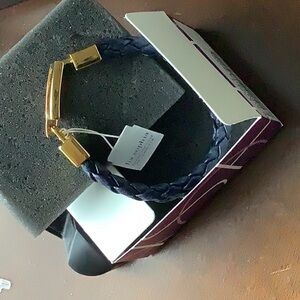 Black leather braided strap bracelet with gold clasp